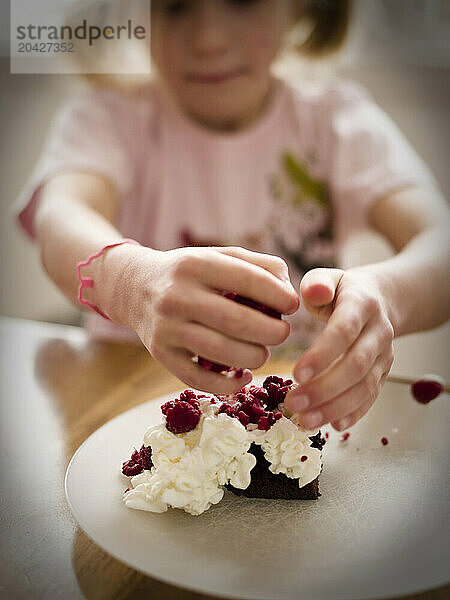 young girl makes dessert