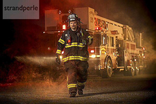 Firefighter and his fire engine  New Holstein  Wisconsin  USA