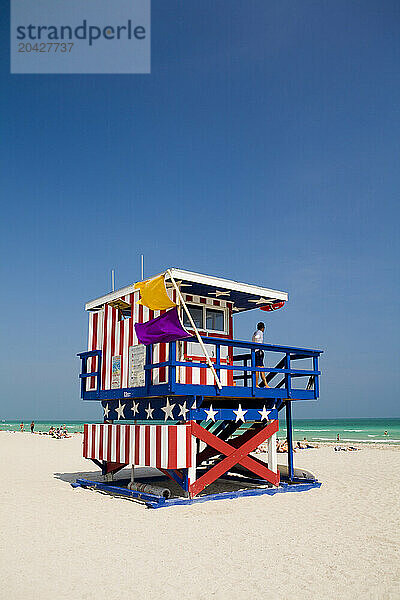 lifeguard on duty looking over the Atlantic Ocean on South Beach  Florida.