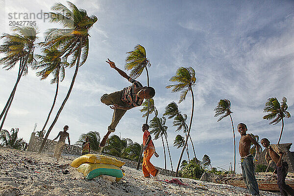 Children playing jump near the beach in Matemwe  Zanzibar