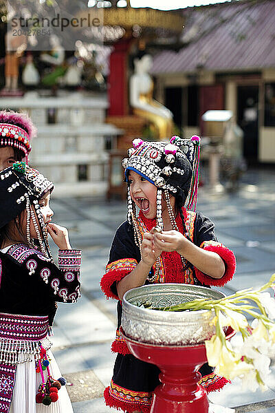 Cute Thai girl dancing in Temple wear traditional dress.Chang Mai hailand