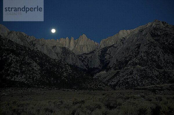 Full moon setting over Mt. Whitney in the Southern Sierra  Ca.