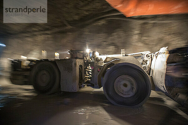 Heavy equipment loader driving in shaft