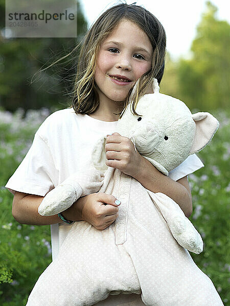 girl and stuffed animal friend