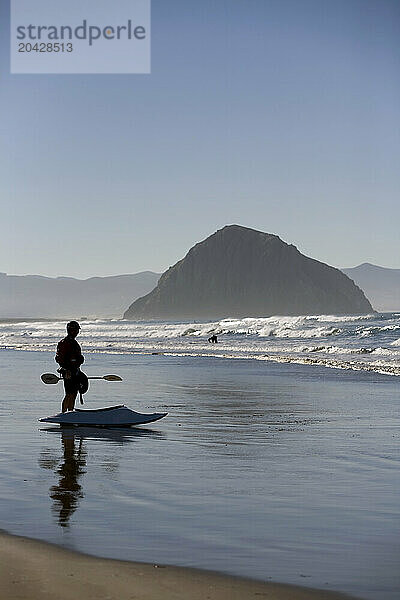 Kayak surfing at Morro Strand State Beach  California