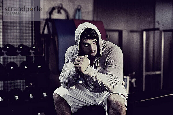 Portrait Of An Young Body Builder In The Gym