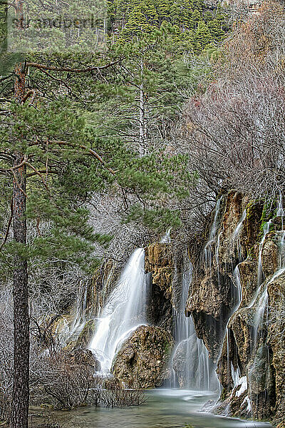 Waterfalls over jutting rocks at the source of the Cuervo river in Guadalajara  Spain.