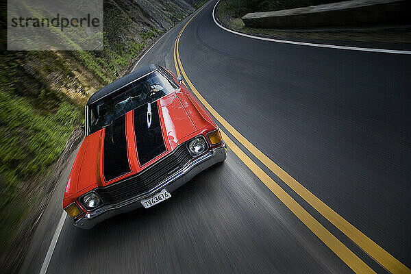 Red Muscle Car on a Mountain Road.