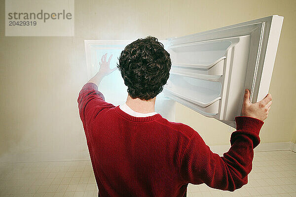 Man reaching into a freezer