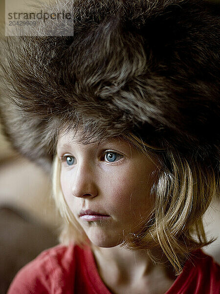 girl in big fur hat