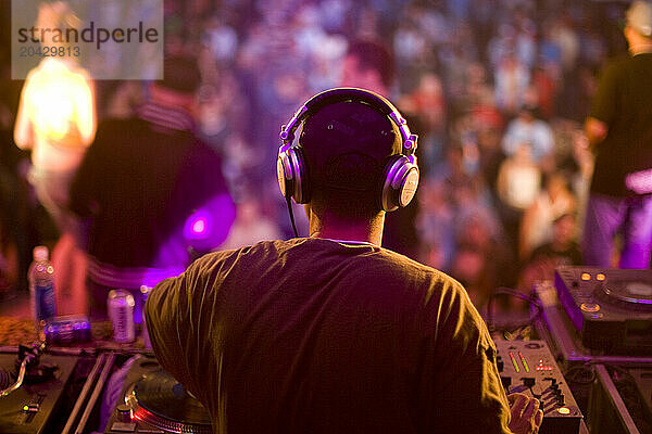 DJ spins music for the huge crowd in Toronto  Ontario.