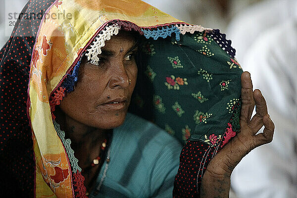 Indian woman with scarf.