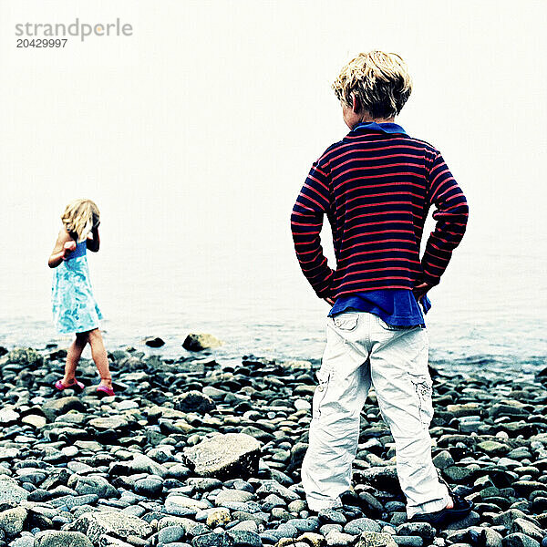 brother and sister on a rocky maine beach