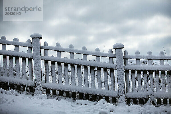 Winter snow covers a fence on Wrightsville Beach