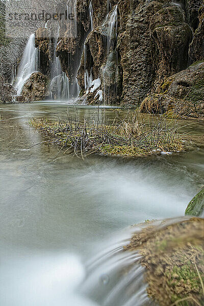 Waterfalls over jutting rocks at the source of the Cuervo river in Guadalajara  Spain.