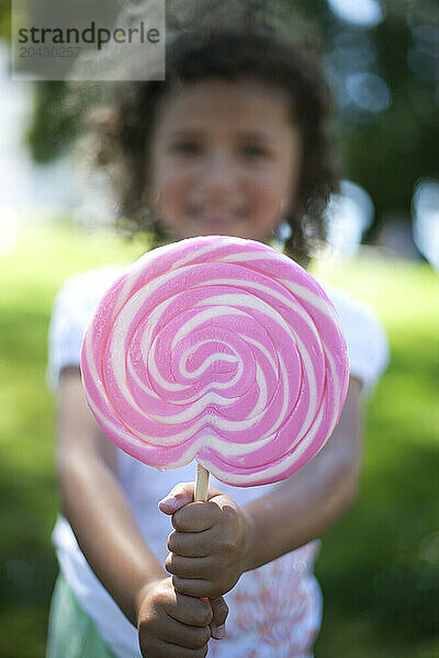 A girl shows off her gigantic sucker.