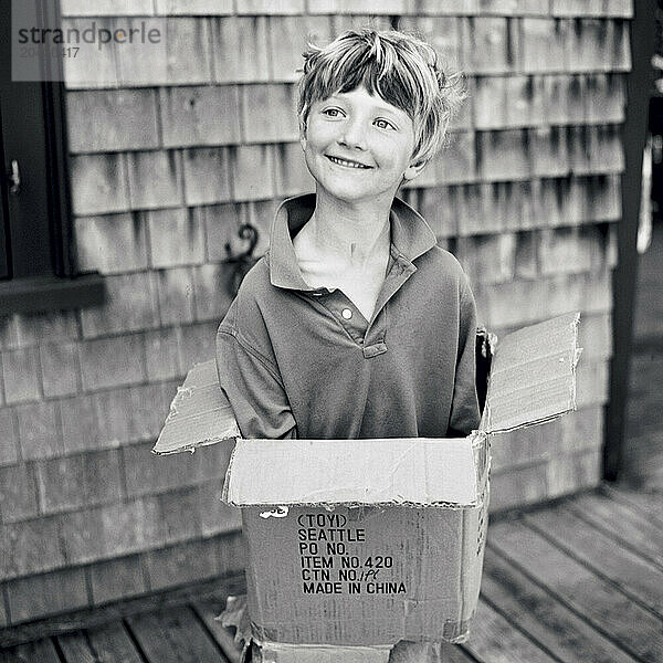 young boy in box