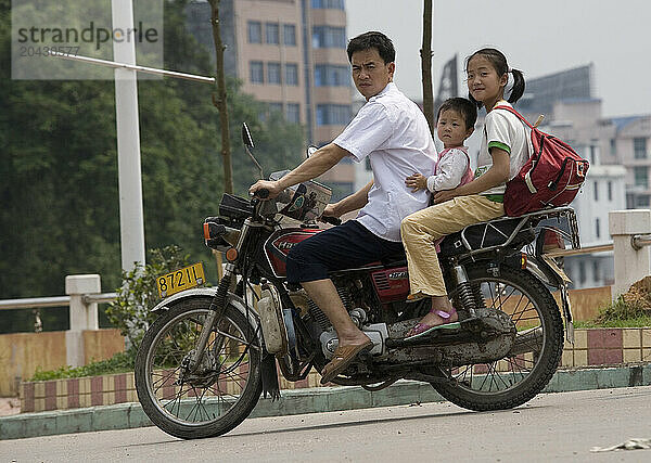 Family on motorcycle.