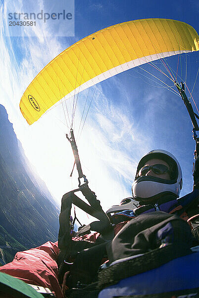 A paraglider flight over the San Juan Mountains  Telluride  Colorado.