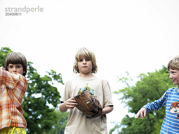 boys play a game of catch  and look tough