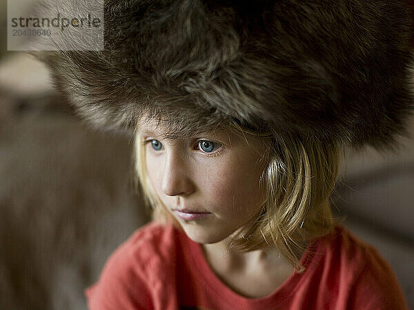 girl in big fur hat