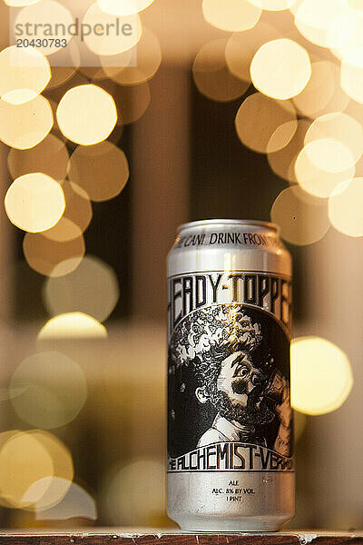 Can of craft beer with bokeh lights