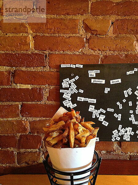 French fries sit on a table at the Duck Fat restaurant in Portland  Maine.