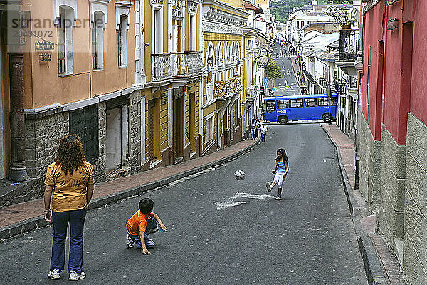 Kids playing football in the Old Town  Quito  Ecuador