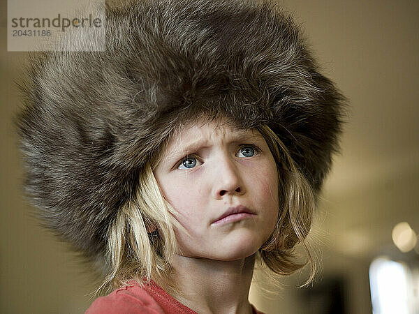 grumpy girl in big fur hat