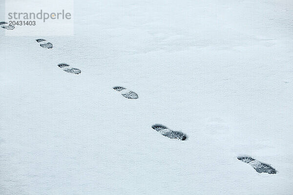 Footprints in the winter snow on Wrightsville Beach