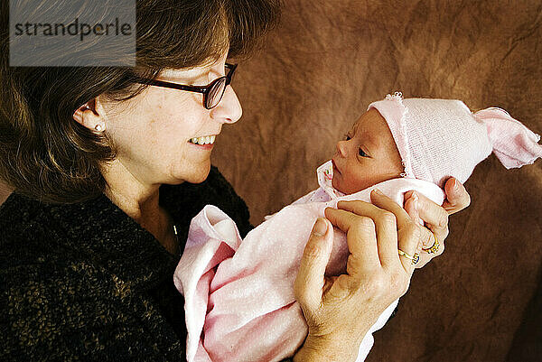 A grandmother holds her newborn granddaughter Flagstaff  Arizona.