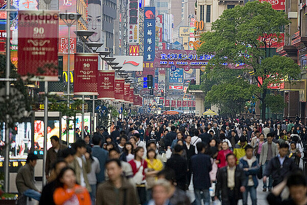 Crowds on the busy pedestrian street of West Nanjing Road  Shanghai  China.