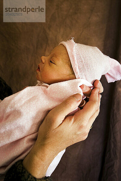 A grandmother holds her newborn granddaughter Flagstaff  Arizona.