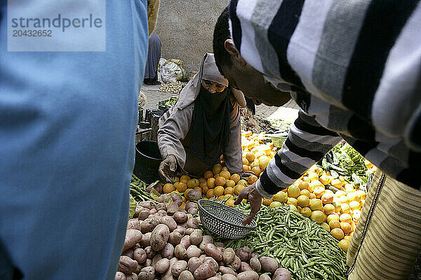 Woman selling vegetables in Moroccan street