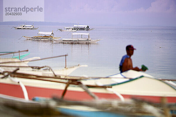 Traditional outrigger fishing boats  MalapascuaÂ Island  Cebu Province  CentralÂ Visayas  Philippines