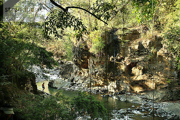 Waterfalls on the Rio Caldera are used by tourists to cool down after visiting the nearby hot springs