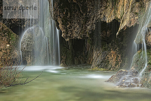 Waterfalls over jutting rocks at the source of the Cuervo river in Guadalajara  Spain.