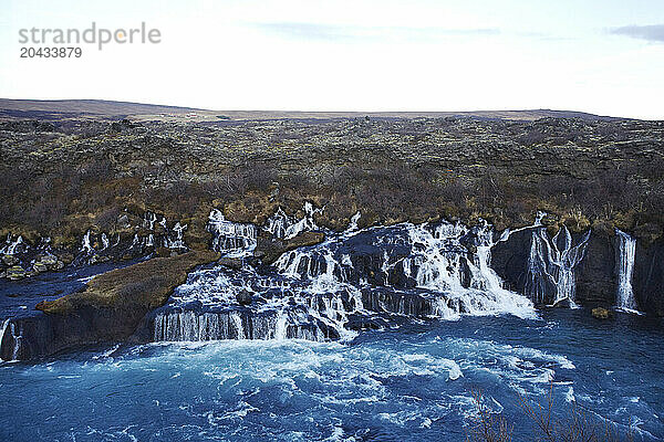 Hraunfossar floating from a lavafield