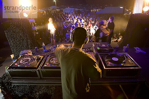 DJ spins music for the huge crowd in Toronto  Ontario.