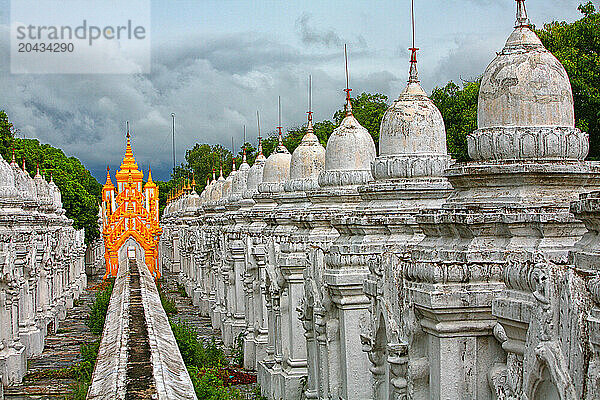 Kuthodaw pagoda in Mandalay. The pagoda contains the world's largest book  and lies at the foot of Mandalay Hill. Built during the reign of King Mindon  in the grounds of the pagod