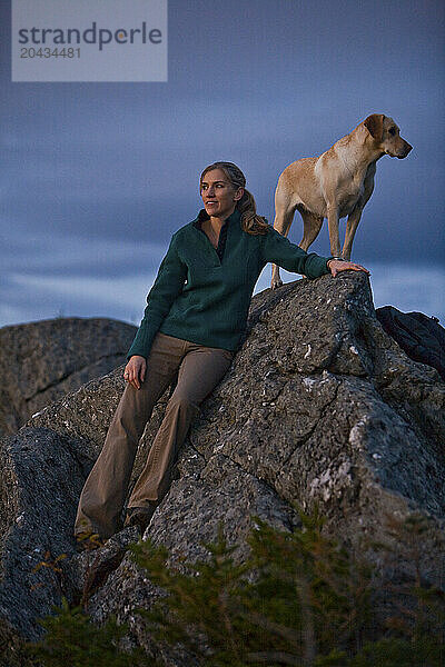 Mid adult woman hiking the Longtrail North to the top of Mt. Abraham in Vermont  USA.