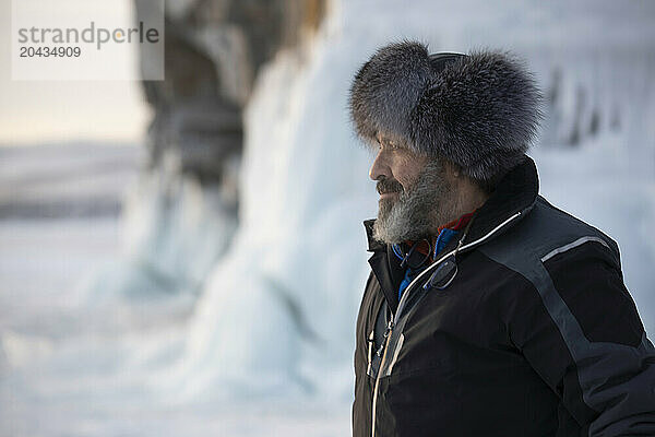 Man in fur hat  Lake Baikal  Irkutsk Oblast  Russia