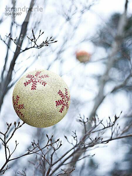 christmas balls decorate an outdoor tree