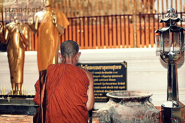 monks praying in a temple