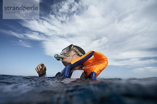 Snorkeler breaking the surface.