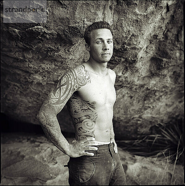 A rockclimber poses for a portrait at Hueco Tanks State Park  Texas