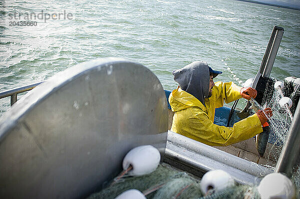 Salmon fisherman setting their fishing gear  Bristol Bay  Alaska  USA