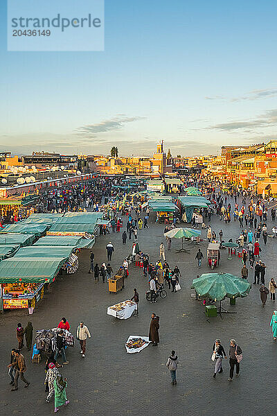 Crowded market on Jamaa El-Fna square at dusk  Marrakesh  Marrakesh-Safi  Morocco