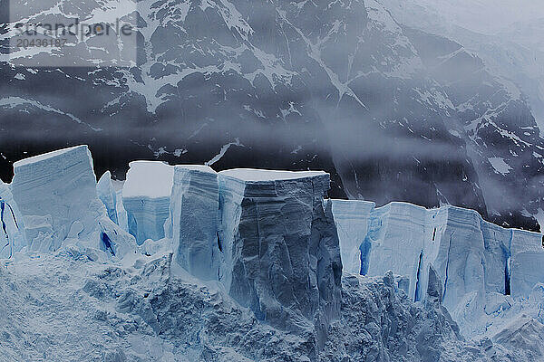 Mist surrounds glacial ice in Paradise Bay  Antarctica.