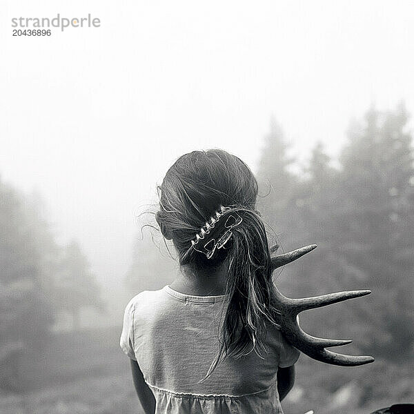 girl with antler in fog